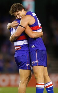 Will Minson and Clay Smith celebrate as the Bulldogs defeat the Brisbane Lions - ${keywords}
